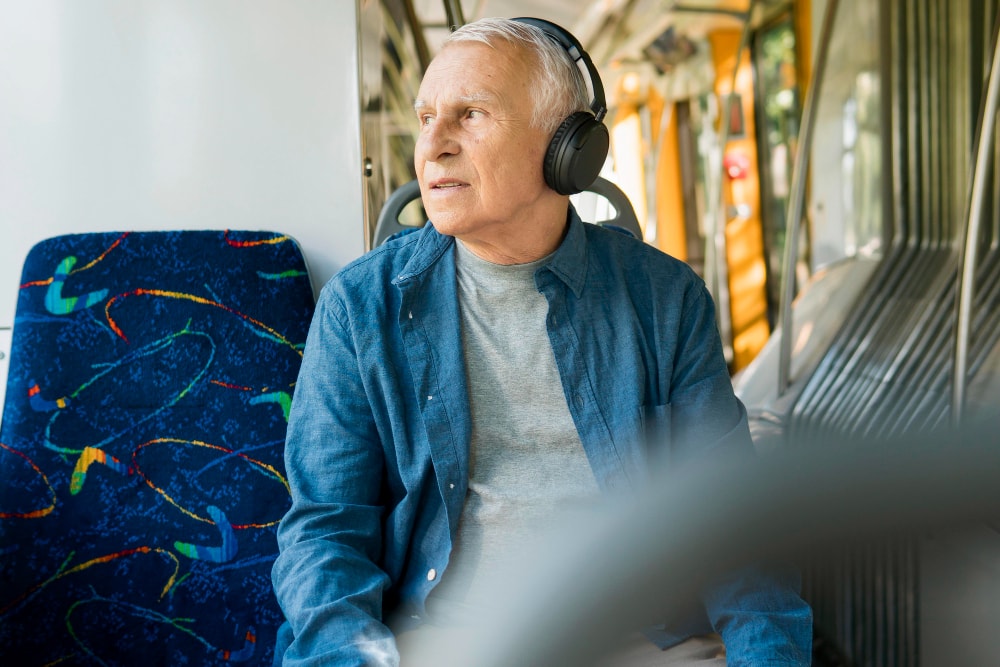 Elderly man on a train